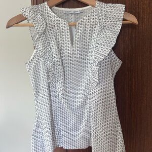 White and Black Ruffled Sleeveless Blouse